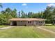 Charming single-story brick home featuring a covered carport and well-maintained lawn at 5 Dogwood St., Hemingway, SC 29554