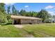 Quaint single-story brick home with an attached carport and a grassy front yard at 5 Dogwood St., Hemingway, SC 29554