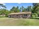 Charming brick home with well-manicured lawn and inviting front porch at 5 Dogwood St., Hemingway, SC 29554