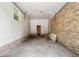 Spacious garage with brick and white walls; potential for multiple uses, with room for parking or storage at 5 Dogwood St., Hemingway, SC 29554