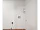 This is a white laundry room corner, showcasing the hookups and space for laundry appliances at 5 Dogwood St., Hemingway, SC 29554