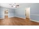 Spacious living room with light blue walls and a view into the adjacent kitchen at 5 Dogwood St., Hemingway, SC 29554