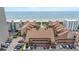 Aerial view of condos and beach with multiple buildings and ocean in the background at 5515 North Ocean Blvd. # 308, Myrtle Beach, SC 29577