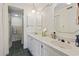 Bright bathroom with double sinks, a large mirror, and tiled floors at 5515 North Ocean Blvd. # 308, Myrtle Beach, SC 29577
