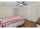 Cozy bedroom featuring a star-patterned quilt, ceiling fan, and closet at 5515 North Ocean Blvd. # 308, Myrtle Beach, SC 29577