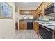 Kitchen with light-colored countertops, wood cabinets, and dark dishwasher at 5515 North Ocean Blvd. # 308, Myrtle Beach, SC 29577