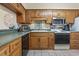 Kitchen with light-colored countertops, wood cabinets, and stainless steel appliances at 5515 North Ocean Blvd. # 308, Myrtle Beach, SC 29577