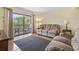 Inviting living room with balcony access, natural light and comfortable seating at 5515 North Ocean Blvd. # 308, Myrtle Beach, SC 29577