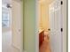 Bathroom doorway leading to toilet, sink, and vanity with carpeted flooring at 56 Willowbend Dr., Murrells Inlet, SC 29576