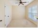 Cozy bedroom featuring a ceiling fan, bright window, and soft carpet at 56 Willowbend Dr., Murrells Inlet, SC 29576