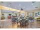 Spacious common area has plenty of tables and chairs and features a pool table and large windows at 56 Willowbend Dr., Murrells Inlet, SC 29576