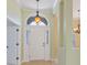 Elegant entryway featuring stylish lighting, high ceilings and decorative columns at 56 Willowbend Dr., Murrells Inlet, SC 29576