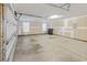 Spacious garage features unfinished walls and concrete floor, offering ample storage and potential for customization at 56 Willowbend Dr., Murrells Inlet, SC 29576