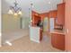 Open kitchen view with breakfast bar, tile flooring, stainless steel appliances, and views to the living room at 56 Willowbend Dr., Murrells Inlet, SC 29576