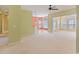 Open-concept living room with modern color scheme, bright windows and carpeted floor at 56 Willowbend Dr., Murrells Inlet, SC 29576