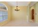 Bright living room with modern color scheme, large windows and carpeted floor at 56 Willowbend Dr., Murrells Inlet, SC 29576