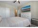 Bedroom featuring a large bed, a dresser with a TV, large windows and a closet at 567 Hickman St., Myrtle Beach, SC 29575