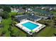 Beautiful community pool featuring ample lounge chairs, mature trees, and a welcoming clubhouse at 567 Hickman St., Myrtle Beach, SC 29575
