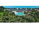 Aerial view of the community pool and clubhouse, surrounded by lush landscaping and seating areas at 567 Hickman St., Myrtle Beach, SC 29575