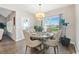 Bright dining area with chandelier, large window, and views of the backyard at 567 Hickman St., Myrtle Beach, SC 29575