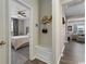 Inviting entryway with view into the main bedroom, bench with storage, hat rack, and views of other rooms at 567 Hickman St., Myrtle Beach, SC 29575