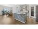 Stylish kitchen featuring a large island with a patterned base, granite countertops, and stainless steel appliances at 567 Hickman St., Myrtle Beach, SC 29575
