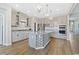Modern kitchen with gray cabinets, granite countertops, stainless steel appliances, and decorative pendant lighting at 567 Hickman St., Myrtle Beach, SC 29575