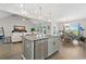 Open-concept kitchen features a center island, stainless steel appliances, and pendant lighting at 567 Hickman St., Myrtle Beach, SC 29575