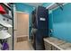 Convenient laundry room with stacked washer and dryer, shelving, and ample storage space for laundry supplies at 567 Hickman St., Myrtle Beach, SC 29575