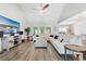 Spacious living room with a large sectional sofa, vaulted ceiling, and seamless transition to the dining area at 567 Hickman St., Myrtle Beach, SC 29575
