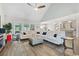 Bright and open living room with hardwood floors, a comfortable sofa, and a view into the modern kitchen at 567 Hickman St., Myrtle Beach, SC 29575