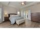 Spacious main bedroom features a tray ceiling, ceiling fan, and ensuite bathroom at 567 Hickman St., Myrtle Beach, SC 29575
