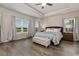 Beautiful main bedroom features a tray ceiling, ceiling fan, and abundant natural light at 567 Hickman St., Myrtle Beach, SC 29575
