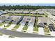 Aerial view of a neighborhood with a pond surrounded by homes at 5826 Cremona Dr., Myrtle Beach, SC 29577