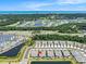 Aerial view of a neighborhood with ponds, golf course, and distant ocean views from the community at 5826 Cremona Dr., Myrtle Beach, SC 29577