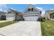 Long driveway leads to the attached two-car garage at 5826 Cremona Dr., Myrtle Beach, SC 29577