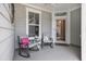 Cozy front porch with rocking chairs and welcome mat at 5826 Cremona Dr., Myrtle Beach, SC 29577