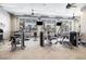 Well-equipped fitness center with modern exercise machines, ceiling fans, and large windows offering scenic views at 5826 Cremona Dr., Myrtle Beach, SC 29577