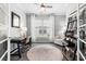 Cozy home office with a desk, comfortable chair, and ample natural light from the large window at 5826 Cremona Dr., Myrtle Beach, SC 29577