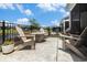 An outdoor patio features a cozy fire pit and comfortable Adirondack chairs at 5826 Cremona Dr., Myrtle Beach, SC 29577
