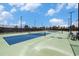 Outdoor tennis courts with blue and green playing surfaces, surrounded by fencing and lighting for evening games at 5826 Cremona Dr., Myrtle Beach, SC 29577