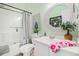 Bathroom featuring a shower and tub combination, vanity with a round mirror and fresh decor at 6001-R11 S Kings Hwy., Myrtle Beach, SC 29575
