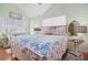 Comfortable bedroom with hardwood floors, two mirrors and lots of natural light at 6001-R11 S Kings Hwy., Myrtle Beach, SC 29575