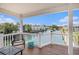 Inviting covered deck with comfortable seating offers serene views of the canal and surrounding waterfront community at 6001-R11 S Kings Hwy., Myrtle Beach, SC 29575