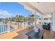 Spacious covered deck with ample seating offers serene waterfront views of the canal and neighboring homes at 6001-R11 S Kings Hwy., Myrtle Beach, SC 29575