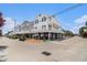Charming elevated beach house with a spacious ground-level patio and views of the surrounding neighborhood at 6001-R11 S Kings Hwy., Myrtle Beach, SC 29575