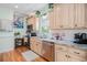 Charming kitchen features marble countertops, stainless steel appliances, and custom cabinets at 6001-R11 S Kings Hwy., Myrtle Beach, SC 29575