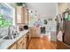 Bright kitchen offers stainless steel appliances, marble countertops, and seamless flow to dining area at 6001-R11 S Kings Hwy., Myrtle Beach, SC 29575