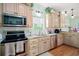 Well-equipped kitchen with stainless steel appliances, granite countertops, and ample cabinet space for storage at 6001-R11 S Kings Hwy., Myrtle Beach, SC 29575