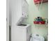 Efficient laundry room features stacked washer and dryer and built-in shelving for storage at 6001-R11 S Kings Hwy., Myrtle Beach, SC 29575